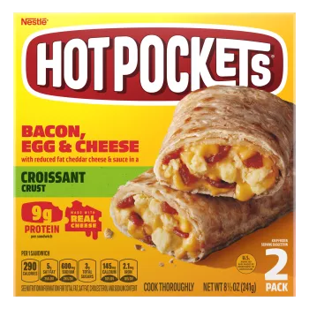 A yellow box of Bacon, Egg & Cheese Hot Pockets with a croissant crusted sandwich on a green label.