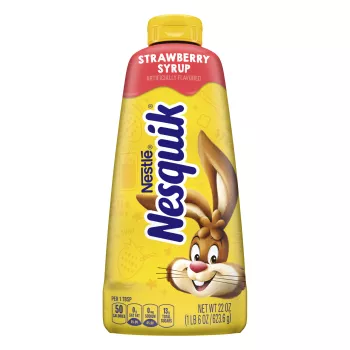 A yellow squeeze bottle with a blue cap, the Nesquik bunny, and red labels surrounding the bunny.