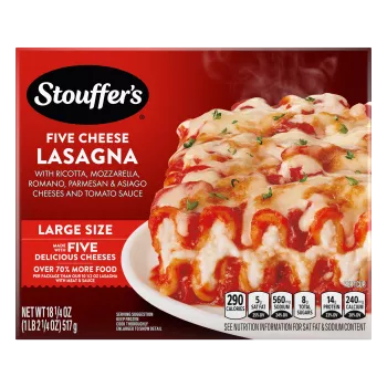 Box of Cheese Lovers Lasagna with a plate of lasagna on a table with the product name and "50% More Cheese" label.