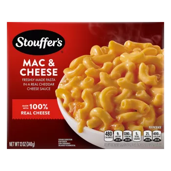 Box of Macaroni & Cheese with a bowl of mac & cheese on a table under the product name and "100% REAL CHEESE" label.