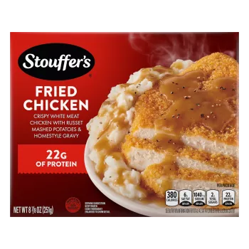 Box of Fried Chicken with a plate of chicken, mashed potatoes and gravy beside the product name and STOUFFER'S logo.