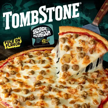 Package of original sausage & mushroom pizza with a teal label and border, a spatula under a pizza, and the Tombstone logo.