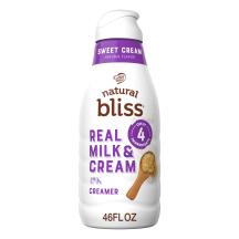 White bottle of natural bliss Sweet Cream Creamer with purple label and a scoop of natural sugar and a splash of cream.
