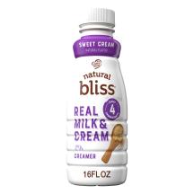 A white bottle of natural bliss Sweet Cream Creamer with a purple label above dairy pitchers and the product name.