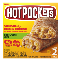 A yellow box of Sausage, Egg & Cheese Hot Pockets with a croissant crusted sandwich on a green label.