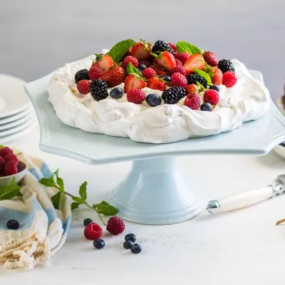 Pavlova with Sweetened Whipped Cream and Fresh Berries