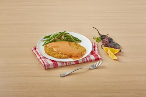 Milanesas in creamy orange sauce