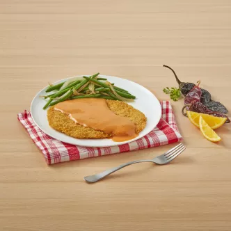 Milanesas in creamy orange sauce