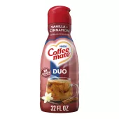 A red bottle of Cinnamon Vanilla Crème creamer with a coffee mug and cinnamon sticks under the Coffee mate logo.