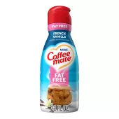 A bottle of French Vanilla Liquid Creamer with a red cap and pink "Fat Free" label above a mug and vanilla beans.