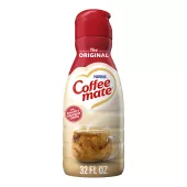 A bottle of Original Creamer with a red label above a coffee mug, biscotti and the product logo.