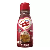 A red bottle of Peppermint Mocha Creamer with a coffee mug, chocolate chunks and peppermint bits under the Coffee mate logo.