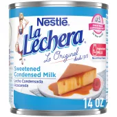 A white can of sweetened condensed milk with blue labels beside the La Lechera logo and a plate of flan.