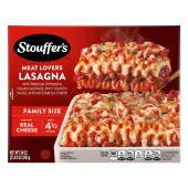 Box of Meat Lovers Lasagna with a plate of lasagna near a dish, the product name, STOUFFER'S logo and "FAMILY SIZE" label.