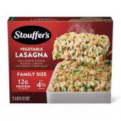 Box of Veggie Lovers Lasagna with a plate and dish of lasagna on a table with the product name and "FAMILY SIZE" label.
