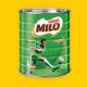 A container and mug of MILO on an image of a young girl dribbling a soccer ball.