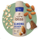 Oats, almonds and pieces of coconut float around a bottle of natural bliss plant based creamer.